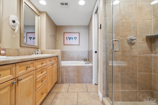 4 Portofino Dr Unit 803, Pensacola Beach, FL 32561 - bathroom with a shower stall, tile patterned flooring, a garden tub, and double vanity