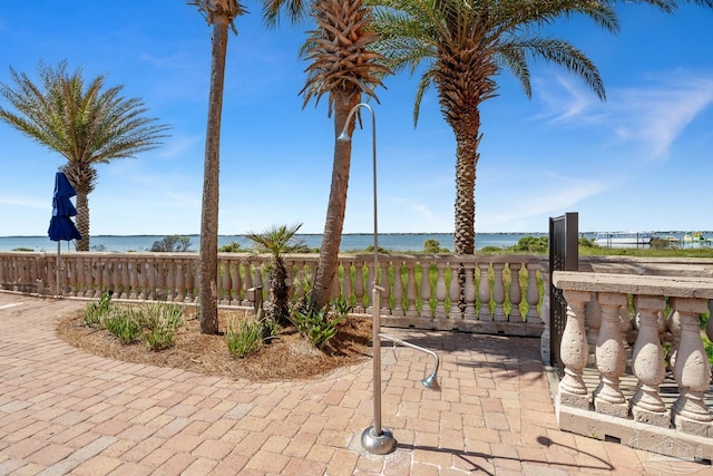 4 Portofino Dr Unit 803, Pensacola Beach, FL 32561 - view of patio / terrace with a water view and fence