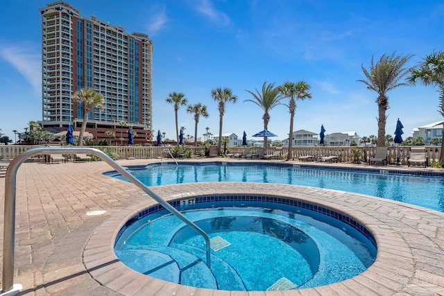 4 Portofino Dr Unit 803, Pensacola Beach, FL 32561 - community pool featuring a hot tub and a patio area