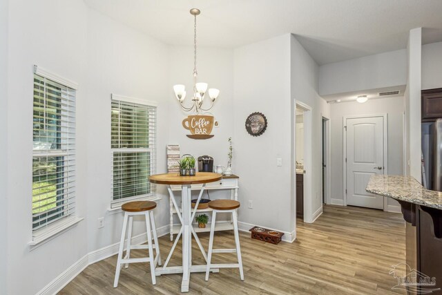 dining area featuring light wood-type flooring