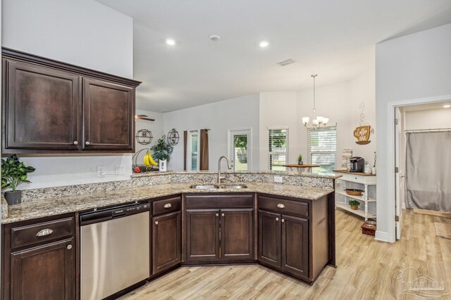 kitchen with light hardwood / wood-style flooring, dishwasher, kitchen peninsula, and sink