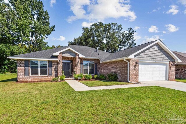 view of front of home featuring a garage and a front lawn