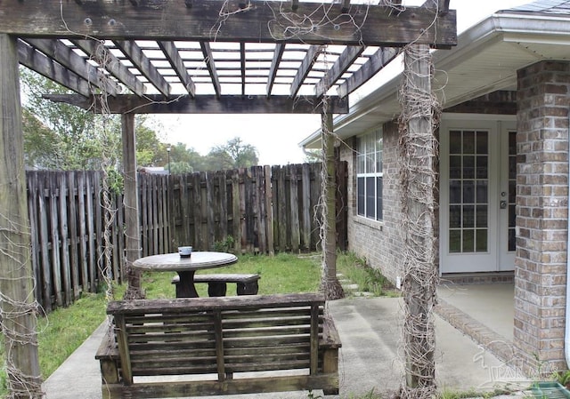 view of patio / terrace featuring fence and a pergola