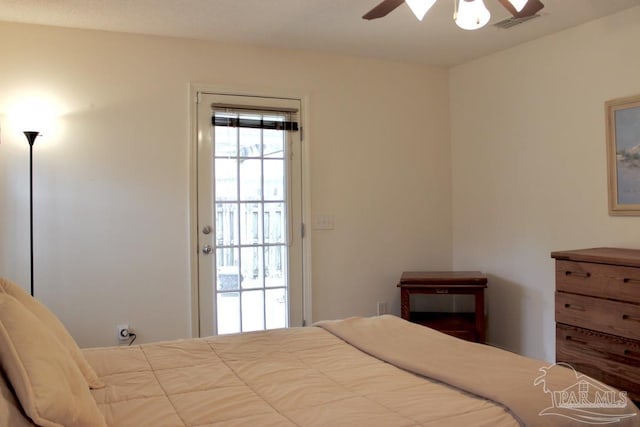 bedroom featuring a ceiling fan and visible vents