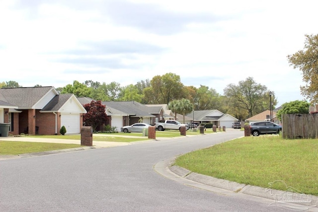 view of road with a residential view and curbs