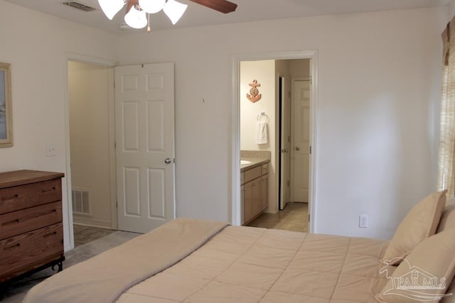 bedroom with visible vents, connected bathroom, ceiling fan, and light tile patterned flooring