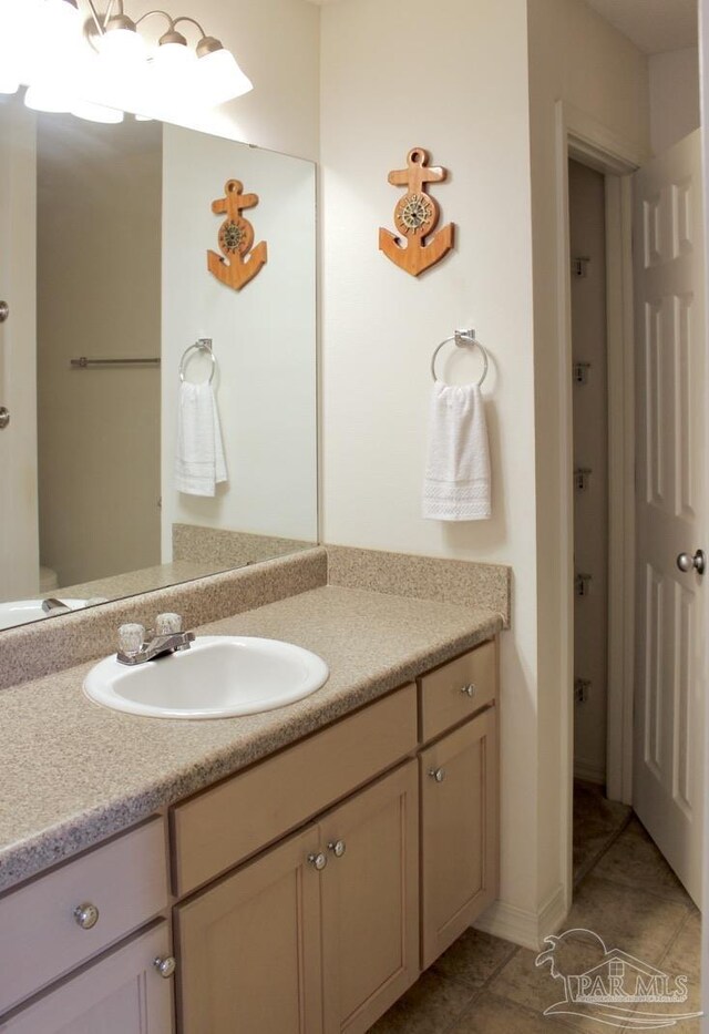 bathroom with vanity and tile patterned flooring