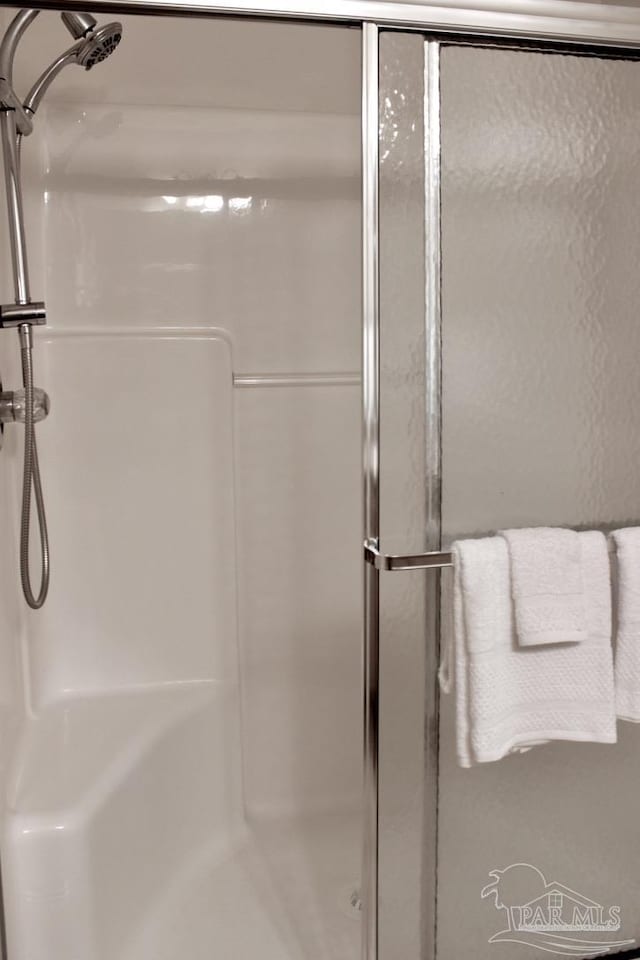 bathroom featuring a stall shower