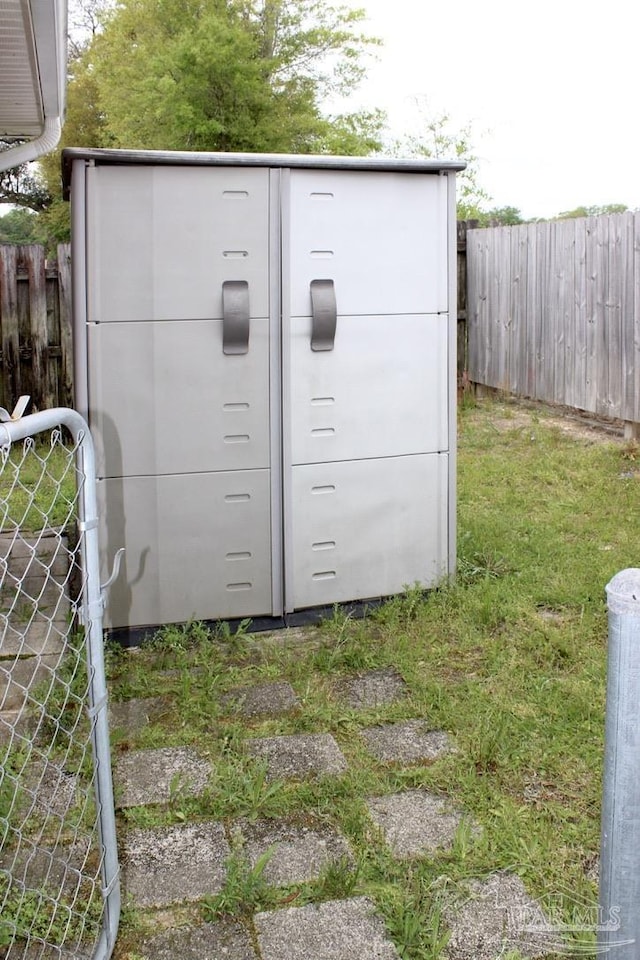 view of outdoor structure featuring fence