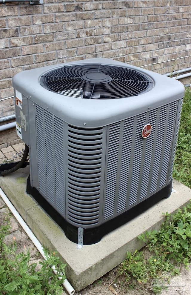 details with central AC unit and brick siding