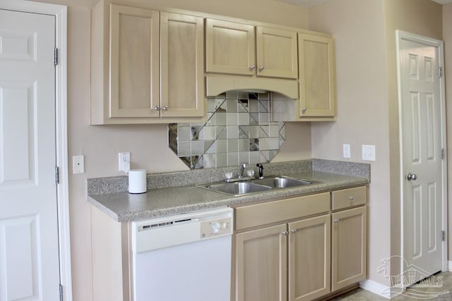 kitchen featuring white dishwasher, light countertops, light brown cabinetry, and a sink