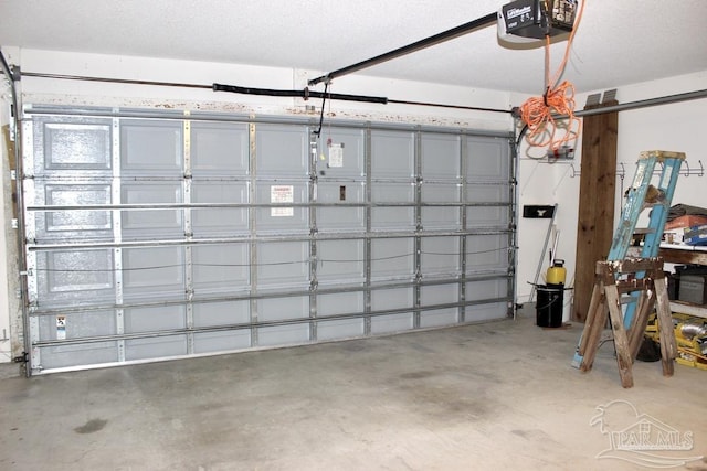 garage featuring a garage door opener