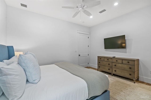 bedroom with ceiling fan and light wood-type flooring