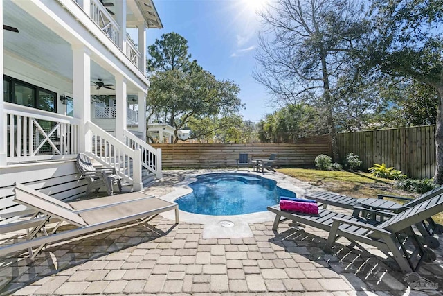 view of pool with a patio and ceiling fan