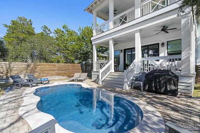 view of pool with a patio, ceiling fan, and a grill