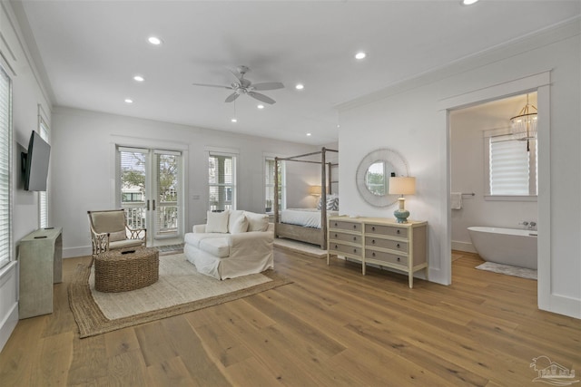 bedroom featuring access to exterior, ceiling fan, crown molding, and wood-type flooring