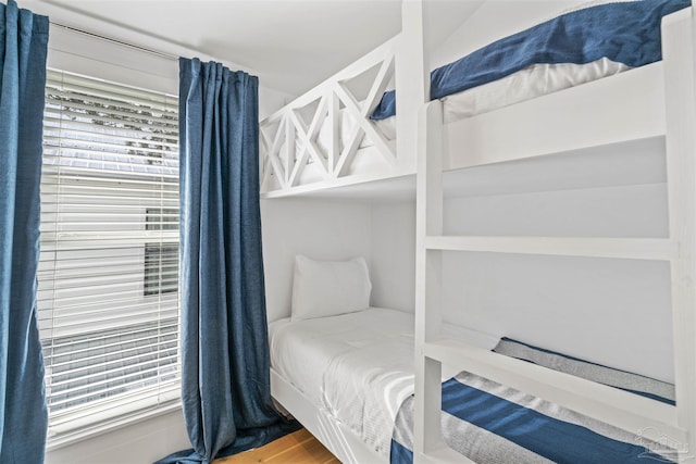 bedroom with hardwood / wood-style floors