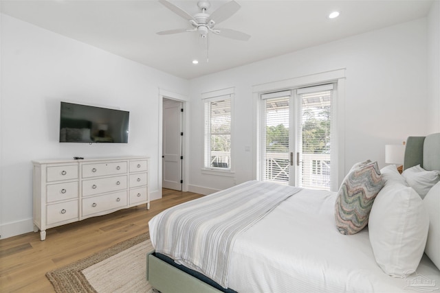 bedroom featuring access to exterior, ceiling fan, and light hardwood / wood-style flooring