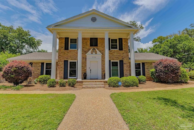 334 Andrew Jackson Trl, Gulf Breeze, FL 32561 - neoclassical / greek revival house featuring brick siding and a front lawn