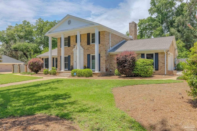 334 Andrew Jackson Trl, Gulf Breeze, FL 32561 - neoclassical home with a chimney and brick siding