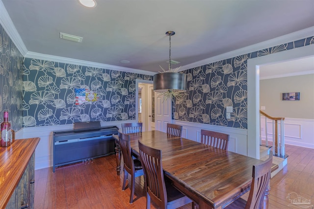 334 Andrew Jackson Trl, Gulf Breeze, FL 32561 - dining room featuring wallpapered walls, wainscoting, hardwood / wood-style flooring, and crown molding