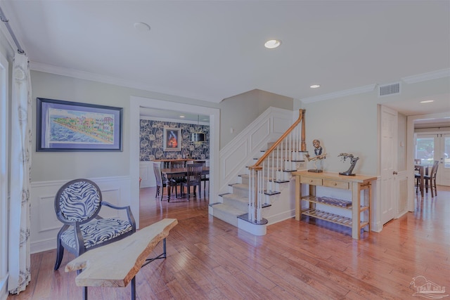 334 Andrew Jackson Trl, Gulf Breeze, FL 32561 - staircase featuring wainscoting, wood finished floors, ornamental molding, and recessed lighting