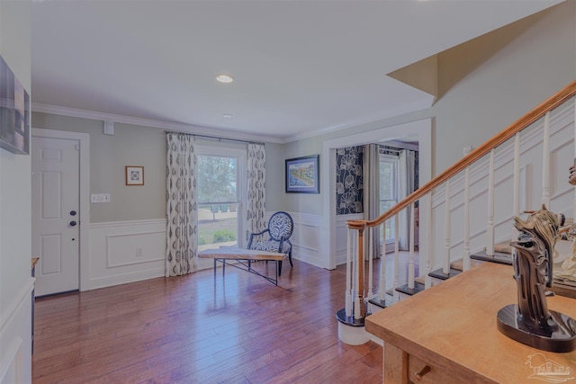 334 Andrew Jackson Trl, Gulf Breeze, FL 32561 - entryway featuring stairs, wainscoting, wood finished floors, crown molding, and a decorative wall