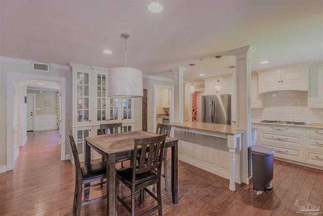 334 Andrew Jackson Trl, Gulf Breeze, FL 32561 - dining area featuring hardwood / wood-style floors, ornamental molding, recessed lighting, and decorative columns