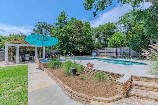 334 Andrew Jackson Trl, Gulf Breeze, FL 32561 - view of swimming pool with exterior kitchen, a fenced backyard, and a patio