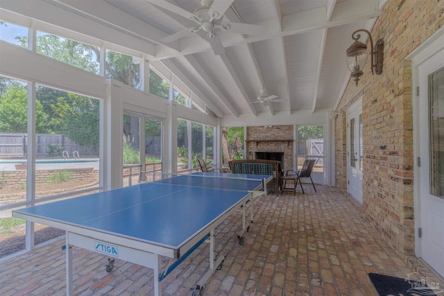 334 Andrew Jackson Trl, Gulf Breeze, FL 32561 - playroom with ceiling fan, healthy amount of natural light, brick floors, brick wall, and a fireplace