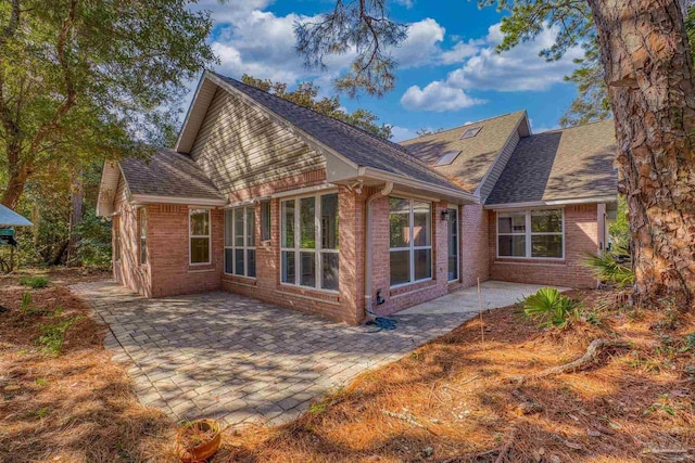 rear view of house with a patio area