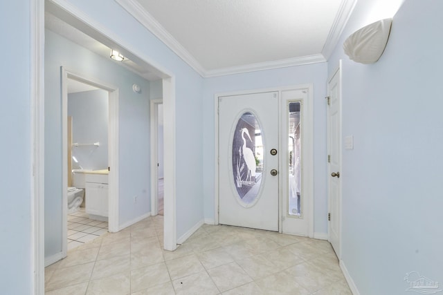 foyer featuring light tile patterned floors and crown molding