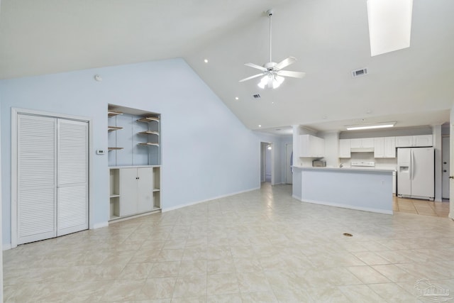 unfurnished living room with high vaulted ceiling, ceiling fan, and light tile patterned flooring