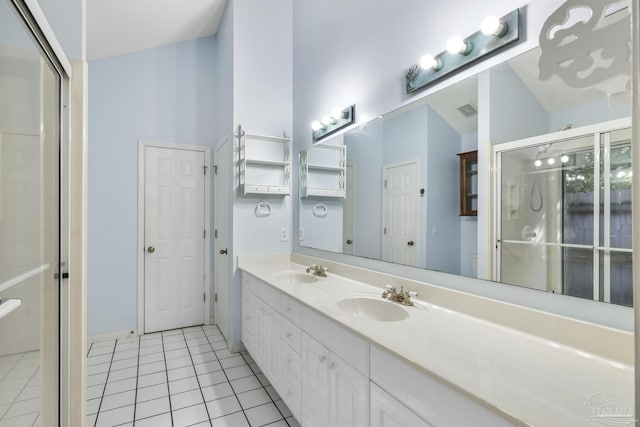 bathroom with tile patterned flooring and vanity