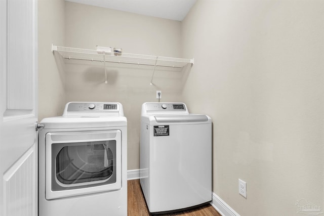 3818 Weatherstone Cir, Pensacola, FL 32507 - washroom with separate washer and dryer and wood finished floors