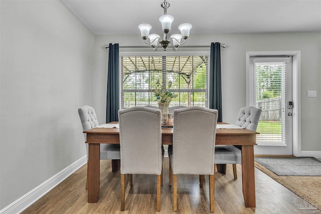 3818 Weatherstone Cir, Pensacola, FL 32507 - dining area featuring a chandelier and wood finished floors