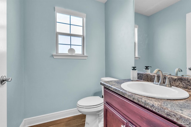 3818 Weatherstone Cir, Pensacola, FL 32507 - half bathroom featuring vanity and wood finished floors