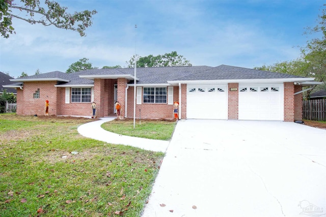 single story home featuring a front yard and a garage