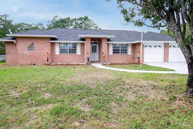 ranch-style house with a garage and a front lawn