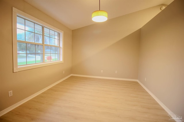 empty room with hardwood / wood-style floors