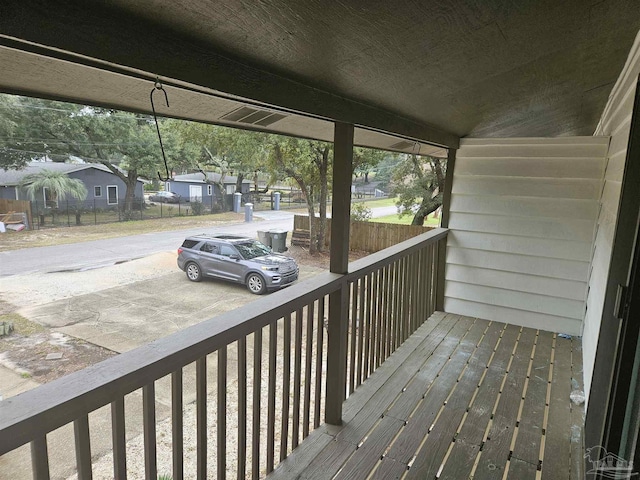 wooden terrace with a residential view