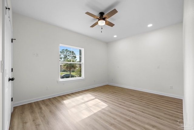 unfurnished room featuring light hardwood / wood-style flooring and ceiling fan