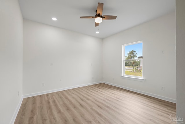 unfurnished room featuring light hardwood / wood-style floors and ceiling fan