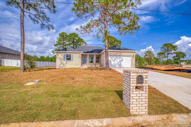 ranch-style house with a front lawn and a garage