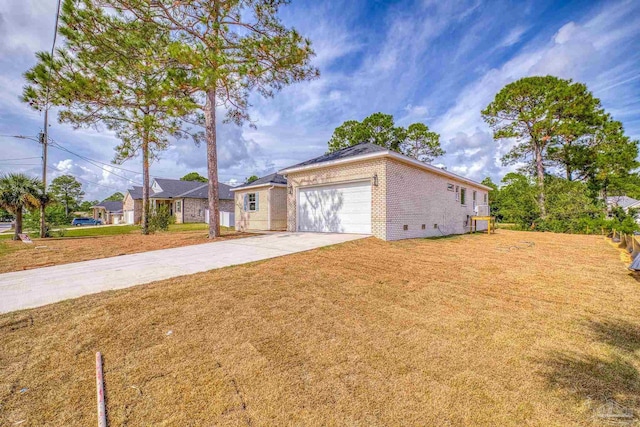 ranch-style home featuring a front yard and a garage