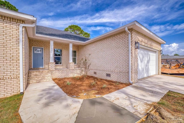 entrance to property featuring a garage