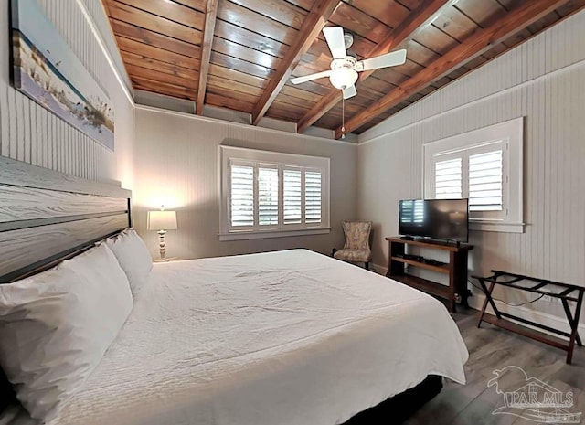 bedroom with ceiling fan, vaulted ceiling with beams, hardwood / wood-style floors, and wooden ceiling