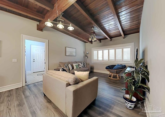 living room featuring vaulted ceiling with beams, wooden ceiling, ceiling fan with notable chandelier, and hardwood / wood-style floors