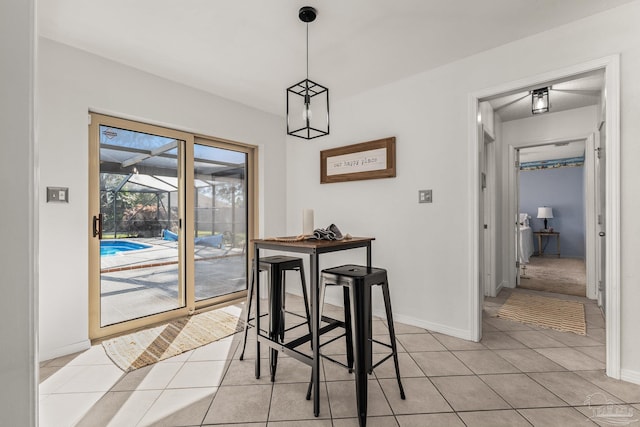 dining area with light tile patterned flooring