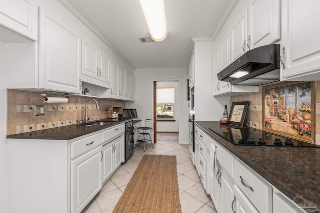 kitchen with white cabinetry, black appliances, sink, and light tile patterned floors